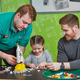 Promotional photo released by Lego showing a Legoland employee helping a child who’s accompanied by an adult (Lego)